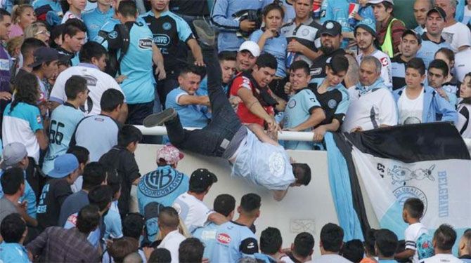 A Belgrano fan sustained head injuries after being thrown from the stands on the suspicion of being a Talleres supporter during a Argentina Primera Division derby match in Cordoba, Argentina on Sunday
