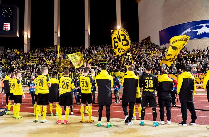 Players of Borussia Dortmund applaud fans after their Champions League quarter-final 2nd leg match against AS Monaco on Wednesday