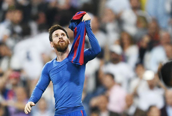 Barcelona's Lionel Messi celebrates after scoring the winner against Real Madrid during their La Liga match at Estadio Bernabeu in Madrid, on Saturday