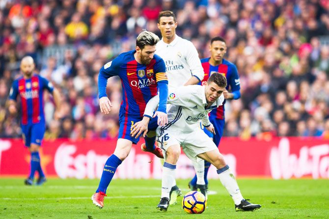 Lionel Messi is challenged by Mateo Kovacic. Messi fequently dropped into midfield to help the team create moves