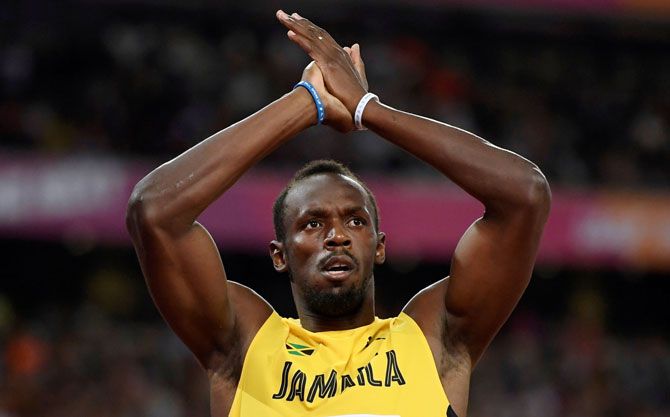Usain Bolt of Jamaica celebrates winning the 100 metres heat during the World Athletics Championships at London Stadium, London, Britain on Friday