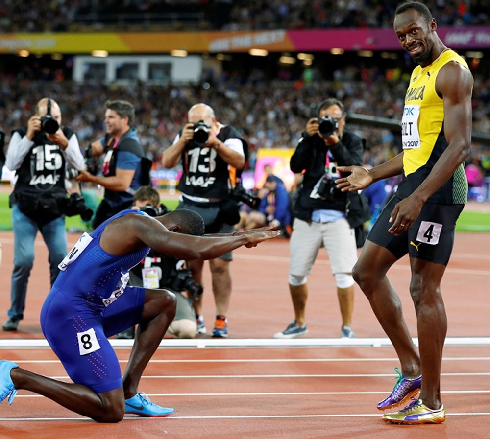 Usain Bolt of Jamaica with Justin Gatlin of the US after the 100m final on Saturday