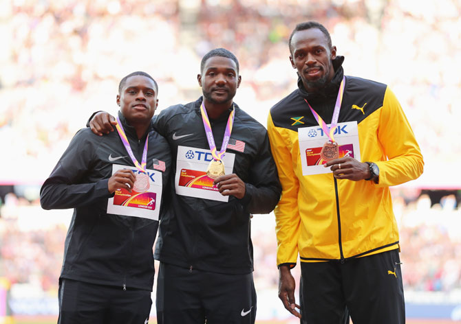 (L-R) Silver medallist Christian Coleman of the United States, gold medallist Justin Gatlin of the United States, and bronze  medallist Usain Bolt of Jamaica, pose with their medals for the Men's 100 metres during day three of the 16th IAAF World Athletics Championships at The London Stadium in London, on Sunday