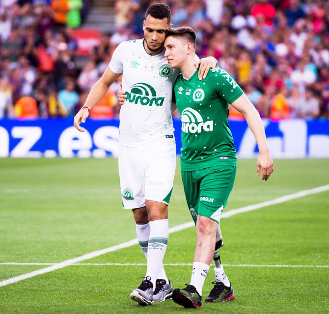 Chapecoense's Helio Neto (left) and Jackson Follmann react after taking the kick-off before the Joan Gamper Trophy match between FC Barcelona and Chapecoense at Camp Nou stadium in Barcelona, Spain, on Monday