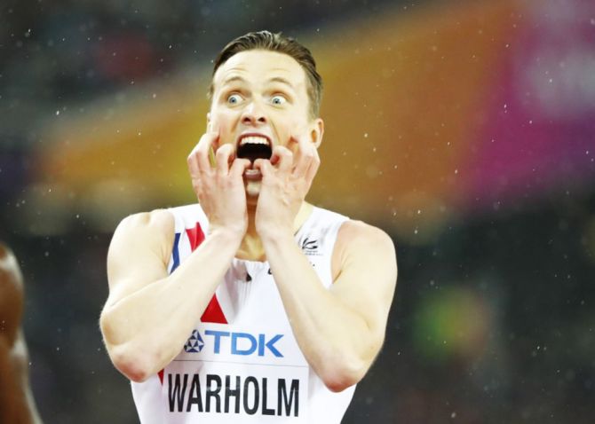 Norway'a Karsten Warholm reacts after winning the Men's 400 Metres Hurdles final at the World Athletics Championships at London Stadium, in London on Wednesday