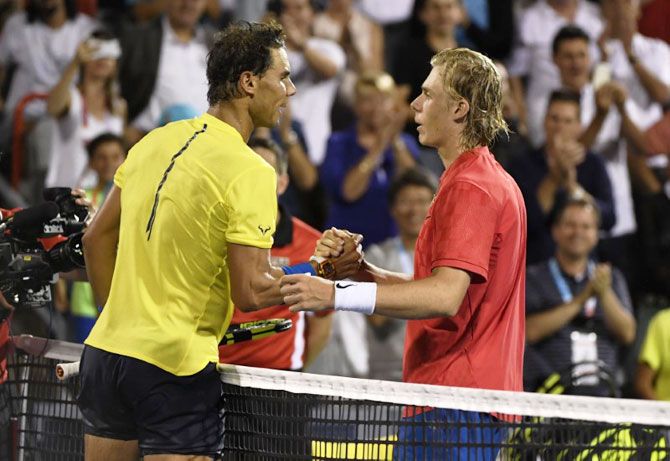 Canada's Denis Shapovalov (right) is congratulated by Spain's Rafael Nadal after their match at the Rogers Cup tennis tournament at Uniprix Stadium in Montreal, Quebec, on Thursday