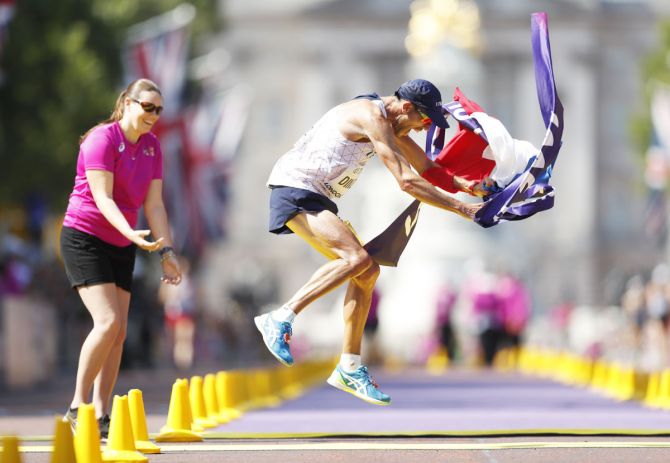 Yohann Diniz of France celebrates winning the gold medal in the men’s 50 km walk at London Stadium in Britain on Sunday