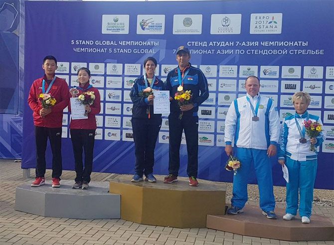 India’s Mairaj Ahmad Khan and Rashmmi Rathore with their gold medal (centre) on the podium on Sunday