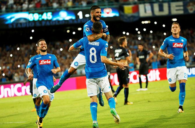 Napoli’s Jorginho celebrates with teammates after scoring their second goal against Nice during the Champions League qualifying play-Off first leg match at Naples in Italy on Wednesday