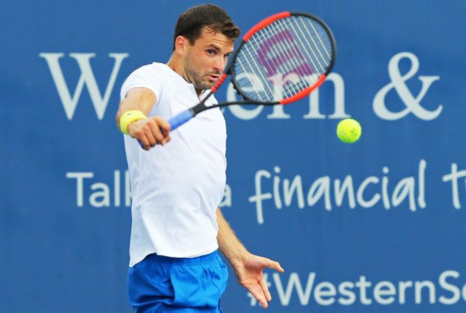 Bulgaria's Grigor Dimitrov returns a shot against Argentina's Juan Martin del Potro during the Cincinnati Western and Southern Open at the Lindner Family Tennis Center in Mason, Ohio on Thursday