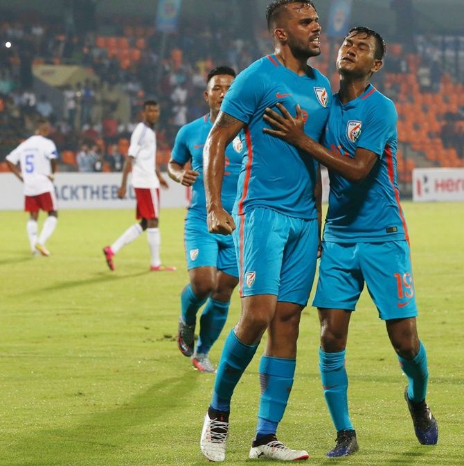 India's striker Robin Singh celebrates a goal