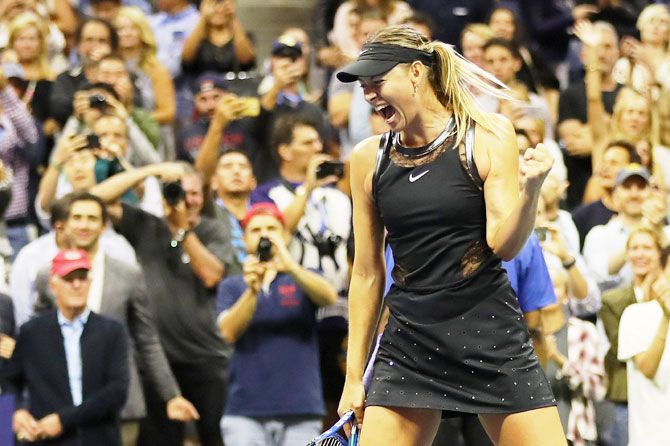 Russia's Maria Sharapova celebrates winning her first round match against Romania's Simona Halep on Day 1 of the 2017 US Open at the USTA Billie Jean King National Tennis Center at the Flushing neighborhood of the Queens borough of New York City on Monday