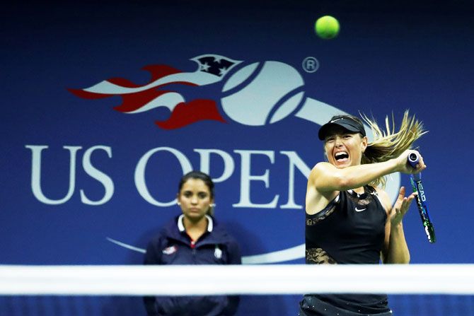 Maria Sharapova in action against Simona Halep in their first round match of the US Open at Flushing Meadows on Monday