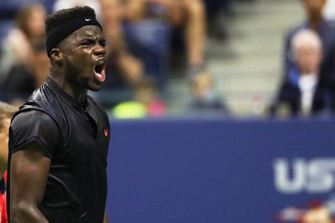 Frances Tiafoe reacts on winning a point