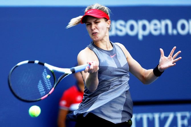 Canada's Eugenie Bouchard in action against Russia's Evgeniya Rodina in their first round match of the US Open on Thursday