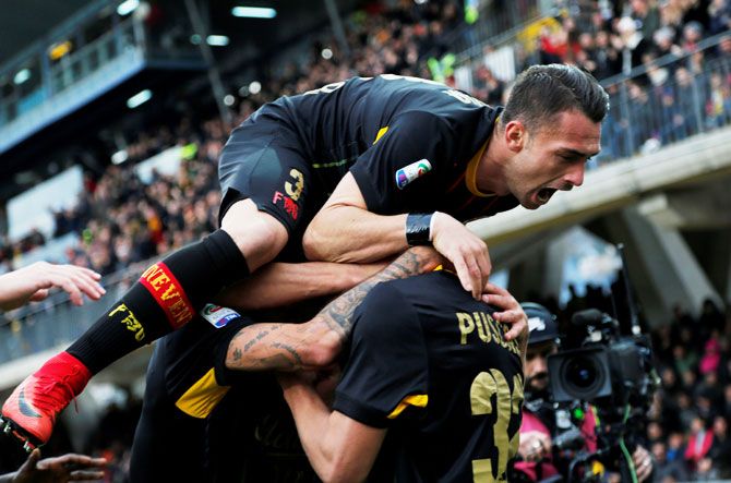 Benevento’s George Puscas celebrates with teammates after scoring their first goal against AC Milan during their Serie A match on Sunday