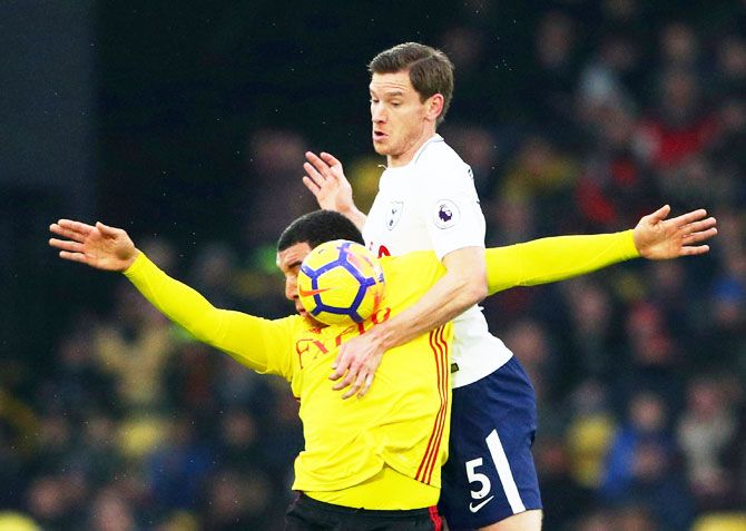 Tottenham's Jan Vertonghen and Watford's Troy Deeney vie for possession during their English Premier League match at Hertfordshire in Watford on Saturday