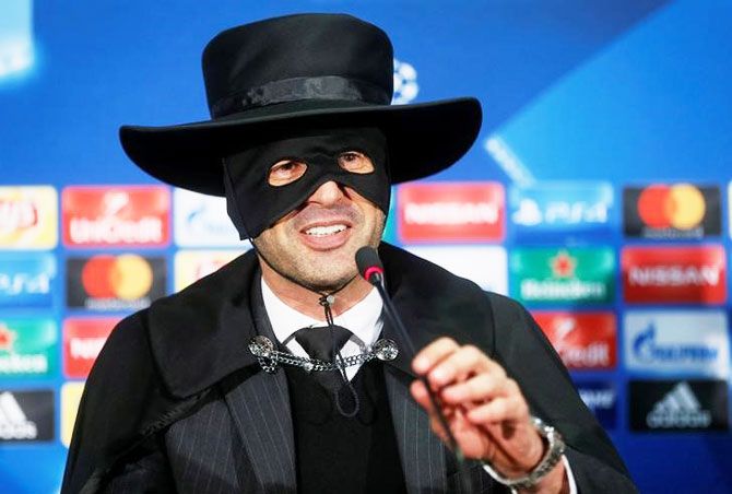 Shakhtar Donetsk's coach Paulo Fonseca, dressed as Zorro, attends a news conference after his club beat Manchester City during their Champions League match at Metalist Stadium, in Kharkiv, Ukraine on Wednesday