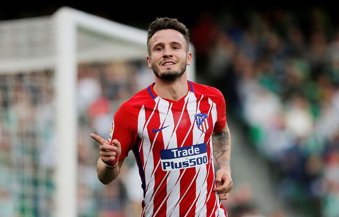 Atletico Madrid's Saul Niguez celebrates after scoring their first goal against Real Betis at Estadio Benito Villamarin, in Seville on Sunday