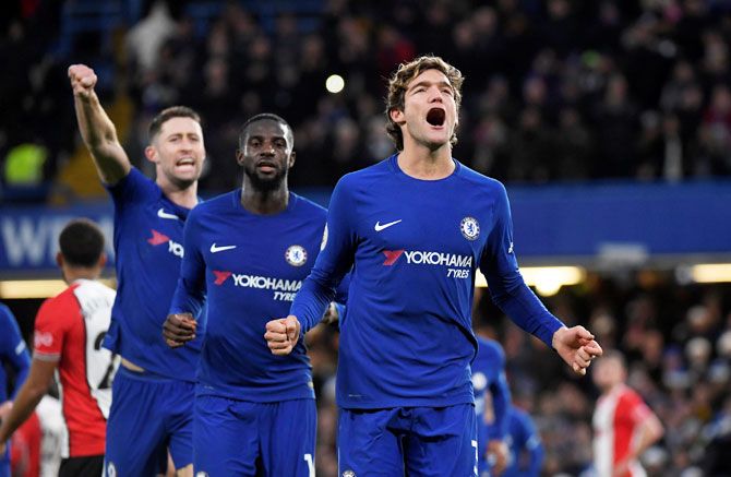 Chelsea's Marcos Alonso celebrates with Tiemoue Bakayoko and Gary Cahill after scoring their first goal against Southampton at Stamford Bridge, in London