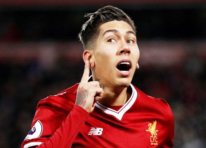 Liverpool's Roberto Firmino celebrates scoring their second goal against Swansea during their English Premier League match at Anfield on Tuesday