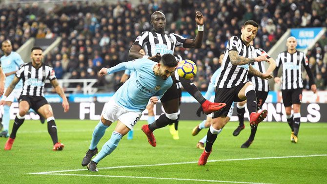 Manchester City's Ilkay Gundogan wins challenge against Newcastle United's Mohamed Diame