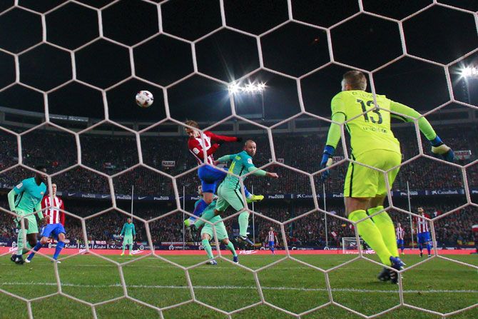 Atletico Madrid's Antoine Griezmann scores their opening goal against FC Barcelona on Wednesday