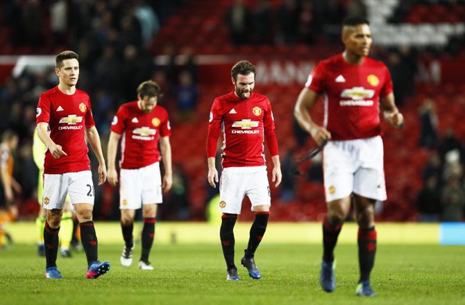 Manchester United's Juan Mata and Ander Herrera wear a dejected look after the game against Hull City at Old Trafford on Wednesday
