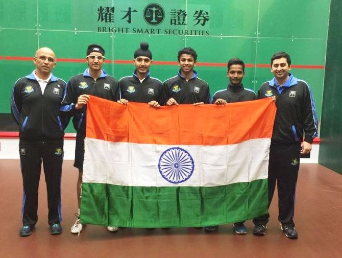 The gold medal-winning boys team hoist the flag at the Asian Junior Squash meet in Hong Kong on Sunday