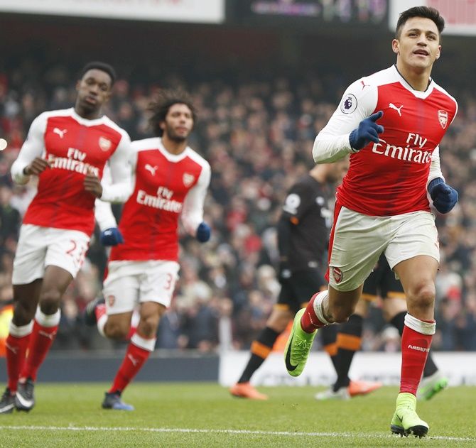 Arsenal's Alexis Sanchez, right, celebrates scoring
