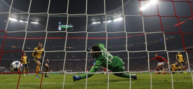 Bayern Munich's Robert Lewandowski scores the second goal against Arsenal. Photograph: Michaela Rehle Livepic/Reuters