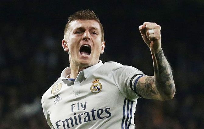 Real Madrid's Toni Kroos celebrates scoring their second goal against Napoli during their UEFA Champions League Round of 16 First Leg match at Estadio Santiago Bernabeu in Madrid on Wednesday
