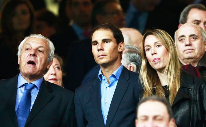Spain's tennis star Rafael Nadal (centre), father Sebastian Nadal (left) and sister Maria Isabel Nadal were in the stands as Real Madrid romped to a 3-1 win over SSC Napoli during their UEFA Champions League Round of 16 first leg match at Estadio Santiago Bernabeu in Madrid on Wednesday