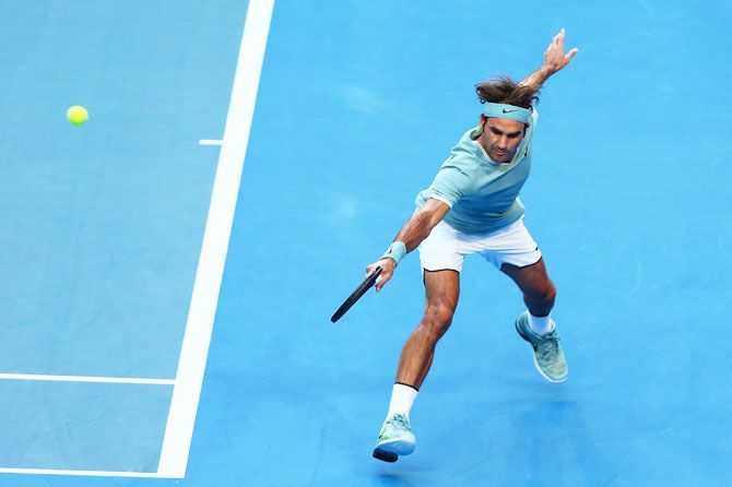 Switzerland's Roger Federer plays a backhand to Great Britain's Dan Evans in the men's singles match on Day 2 of the 2017 Hopman Cup at Perth Arena in Perth on Monday