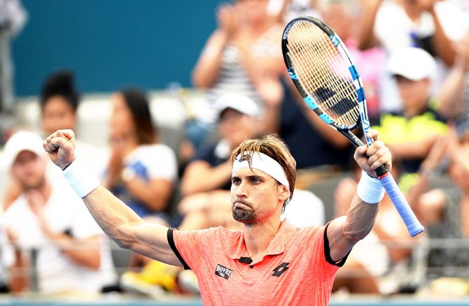 Spain's David Ferrer celebrates victory after his match against Australia's Bernard Tomic  on Day 2 of the 2017 Brisbane International at Pat Rafter Arena in Brisbane on Monday