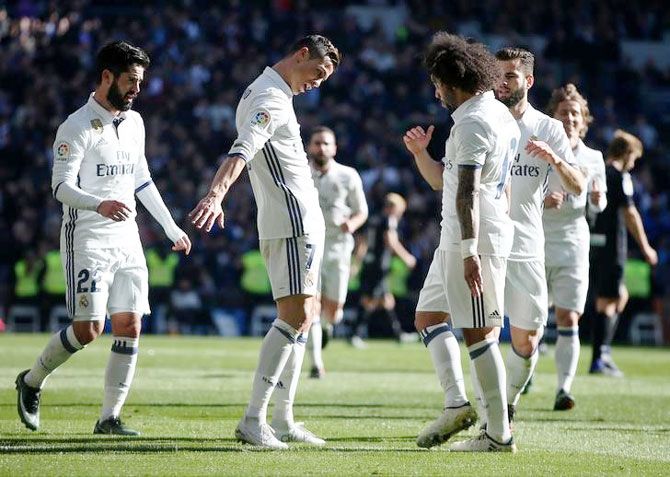 Real Madrid's Cristiano Ronaldo celebrates his goal against Grenada during their La Liga match at the Santiago Bernabeu in Madrid on Saturday