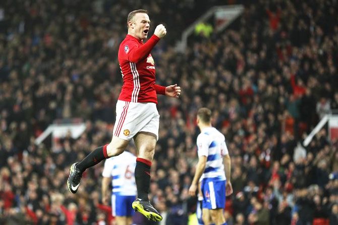Manchester United's Wayne Rooney celebrates scoring the team's first goal during their FA Cup 3rd round match against Reading FC at Old Trafford in Manchester on Saturday