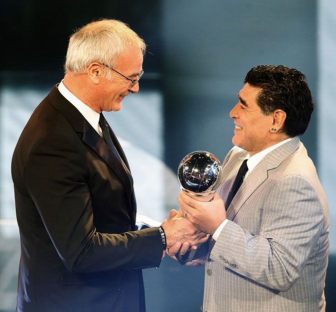 Diego Maradona presents the Manager of the Year Award to Claudio Ranieri whose unfancied Leicester City won the English Premier League last season. Photograph: Ruben Sprich/Reuters