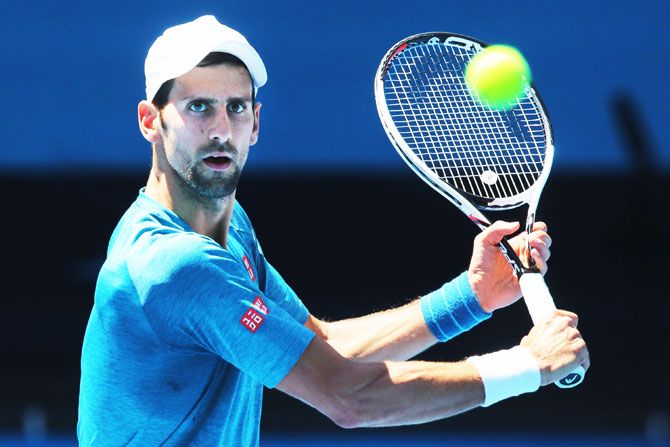 Serbia's Novak Djokovic hits a backhand volley during a practice session on Thursday, ahead of the 2017 Australian Open at Melbourne Park in Melbourne, Australia