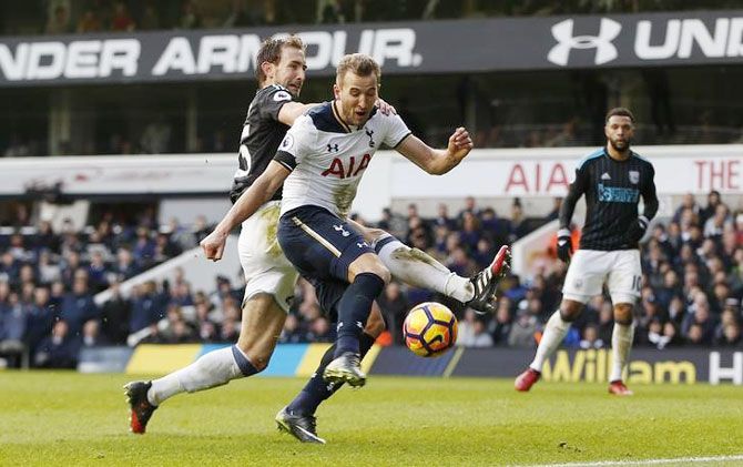 Tottenham's Harry Kane scores their fourth goal to complete his hat trick against West Bromwich Albion during their English Premier League match at White Hart Lane in London on Saturday