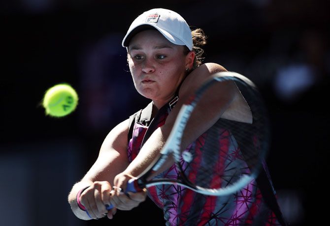 Australia's Ashleigh Barty plays a backhand during her first round match against Germany's Anikka Beck on day one of the 2017 Australian Open at Melbourne Park on Monday