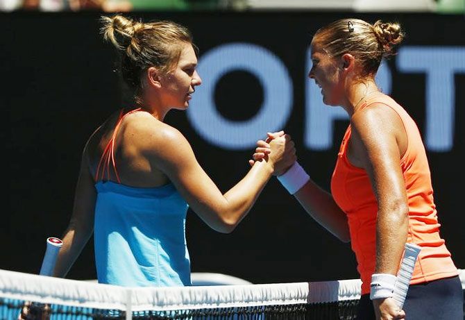 American Shelby Rogers is congratulated by Romania's Simona Halep after winning her first round match at the Australian Open in Melbourne on Monday
