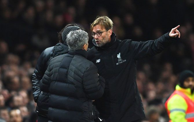 Manchester United manager Jose Mourinho and his Liverpool counterpart Jurgen Klopp argue on the touchline during the Premier League match between Manchester United and Liverpool at Old Trafford on Sunday