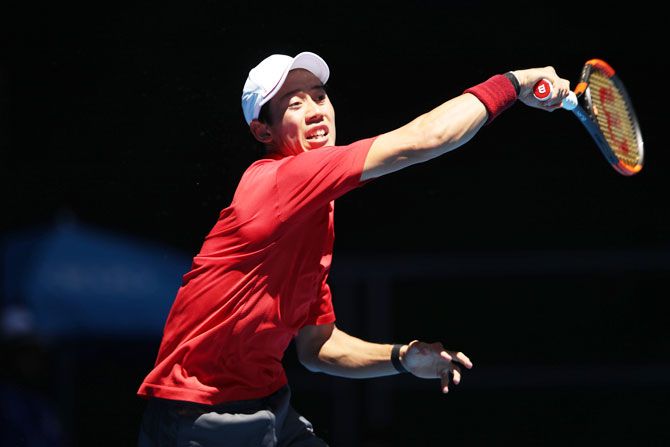 Japan's Kei Nishikori plays a forehand during his gruelling first round match against Russia's Andrey Kuznetsov at the 2017 Australian Open at Melbourne Park on Monday