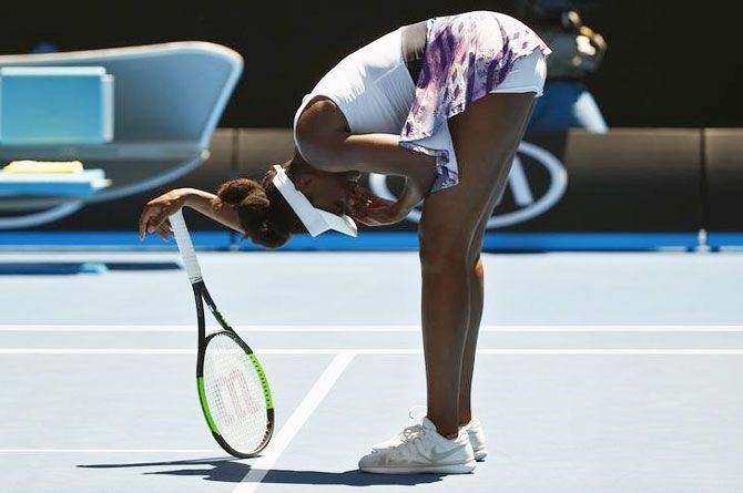 Venus Williams reacts during her first round match against Ukraine's Kateryna Kozlova