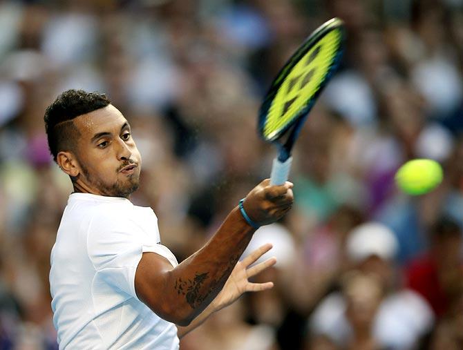 Nick Kyrgios plays a forehand