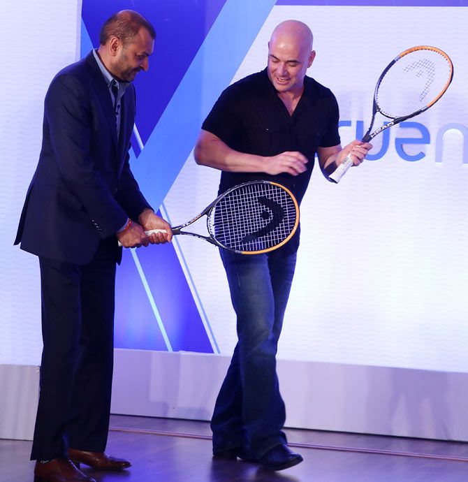 Vishal Nevatia, Managing Partner of True North (left), gets some tennis lessons from the champion player himself
