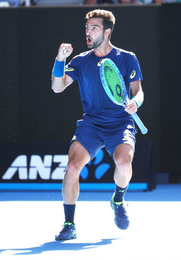 USA's Noah Rubin celebrates a point in his second round match against Roger Federer