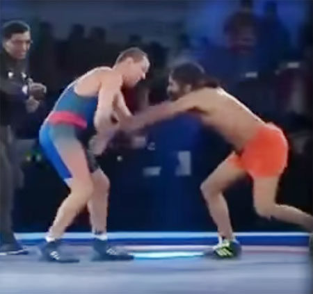 A video grab of Baba Ramdev in a wrestling bout with Beijing Olympic silver medalist Andrey Stadnik