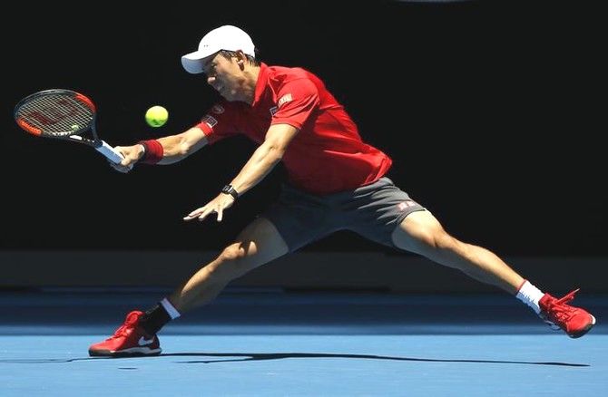 Japan's Kei Nishikori hits a shot during his men's singles second round match against France's Jeremy Chardy at the Australian Open in Melbourne Park on Wednesday